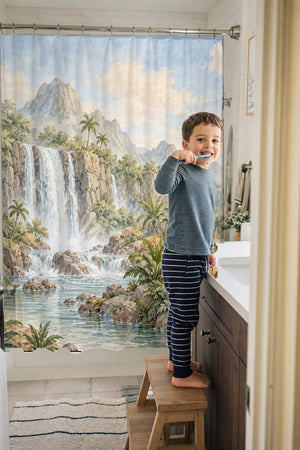 Child brushing teeth in a family bathroom with the Tropical Dinosaur Garden shower curtain