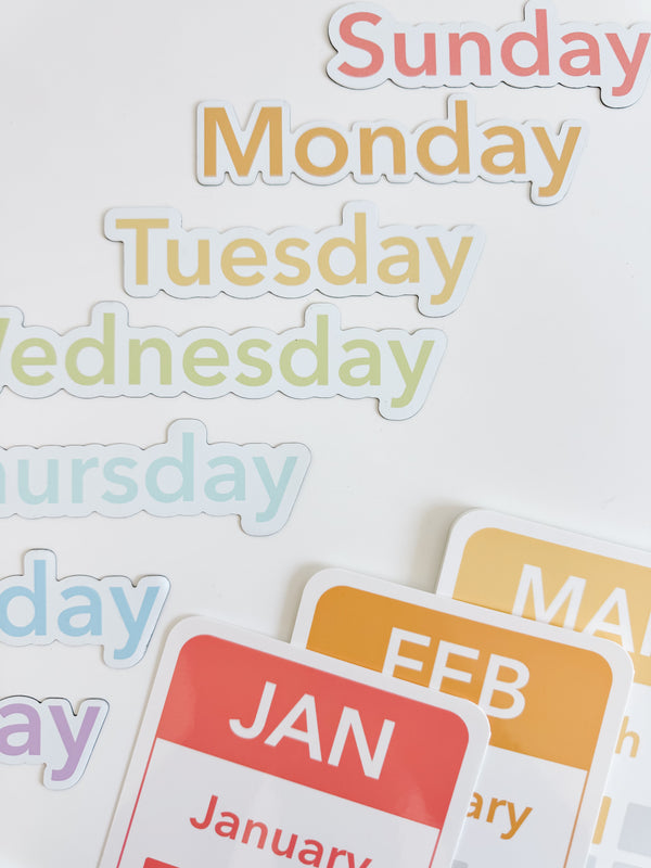 Colorful calendar flashcards and magnets for early learning, featuring days, months, and seasons for sensory play.