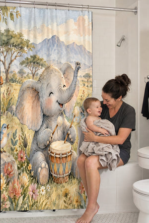 Mom holding her baby on the tub edge next to the Elephant Drum shower curtain