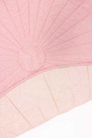 Linen quilted playmat in Galah/Sparrow design, showcasing angle 2 for stylish baby playtime.