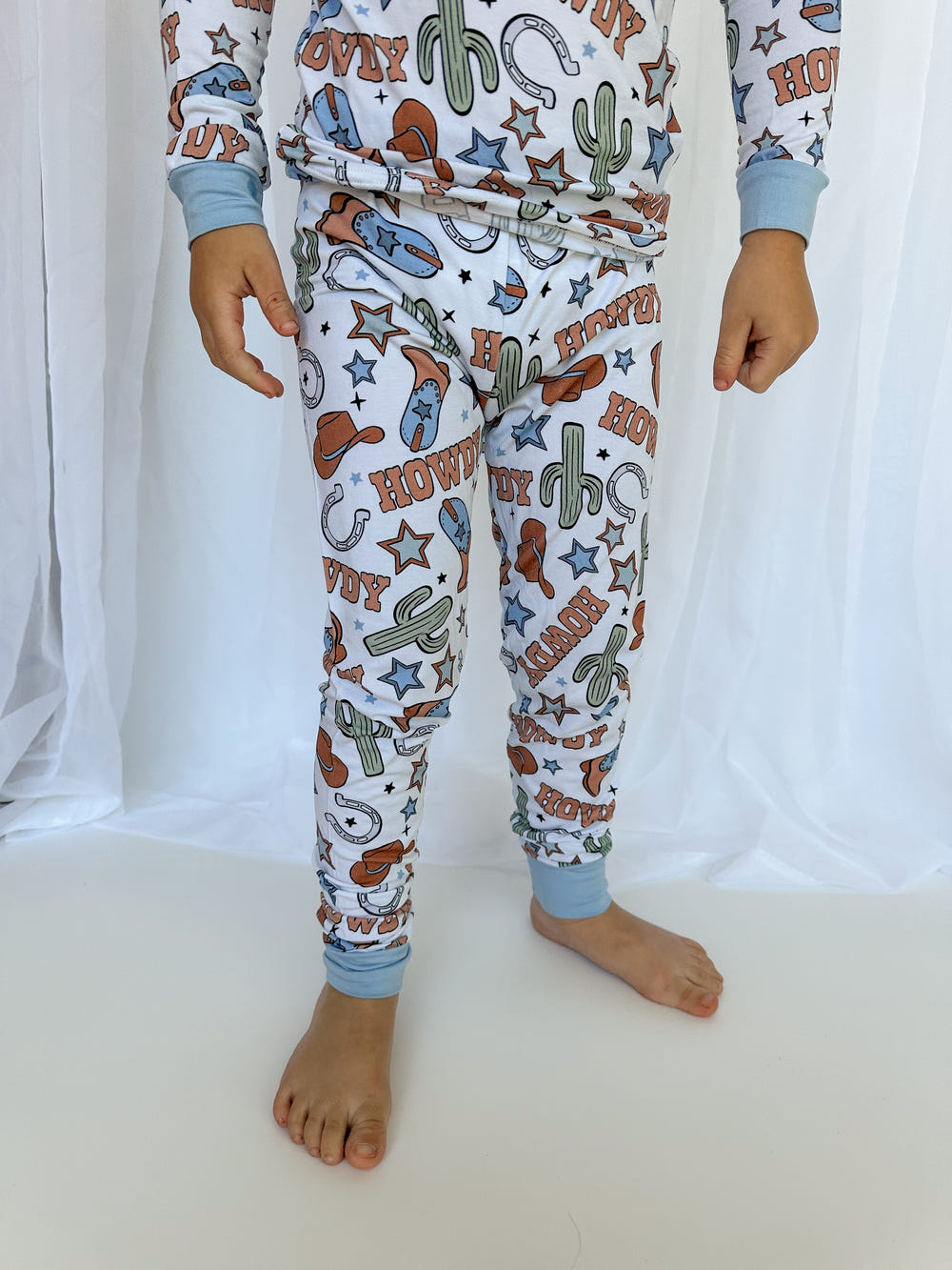 Howdy Partner Set sleepsuit for babies, featuring a cozy design perfect for sleep and play.