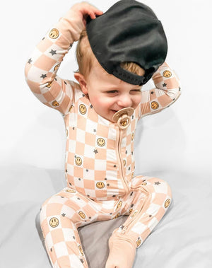 Checked Out Zippy: Cozy zip pajamas for babies in a stylish checked pattern. Perfect for comfort and easy dressing.