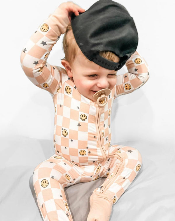 Checked Out Zippy: Cozy zip pajamas for babies in a stylish checked pattern. Perfect for comfort and easy dressing.