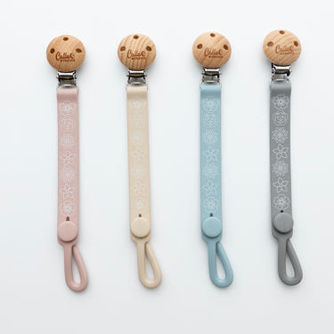 Nash Everything Clip in Blossom design, a stylish and functional pacifier clip for babies.