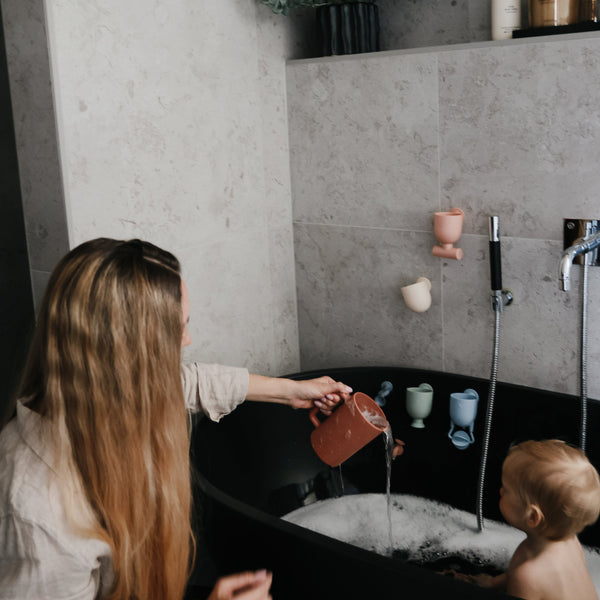 "Colorful baby bath rinse cup at a 30-degree angle, perfect for gentle rinsing during bath time."