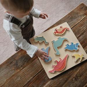 Colorful wooden dino puzzle at angle 6, perfect for toddlers' learning and playtime.
