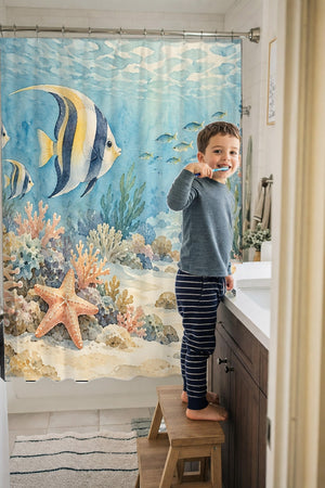 Child brushing teeth in a family bathroom with the Coral Reef Ocean shower curtain