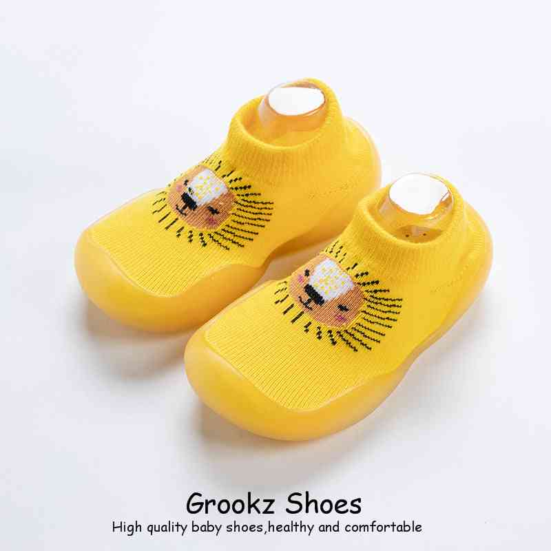 Yellow lion animal sock shoes for babies, best seller, soft and comfortable footwear for little ones.