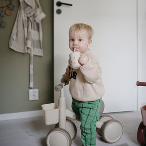 Silicone training cup with straw at a 46-degree angle, perfect for toddlers learning to drink independently.