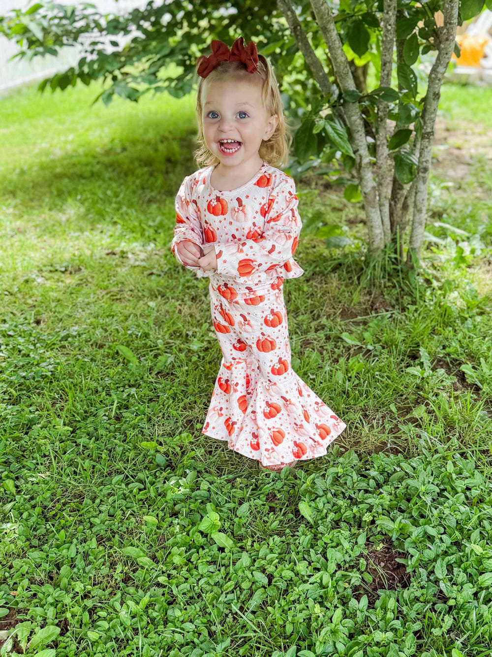Pumpkin bow high-waisted ruffle bell set for babies, perfect for playtime and special occasions.
