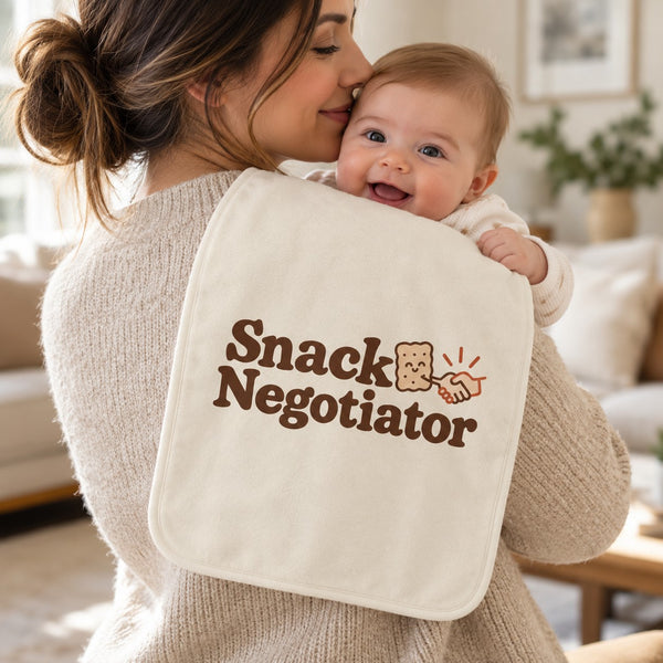 Snack Negotiator burp cloth in cream, styled photo 1