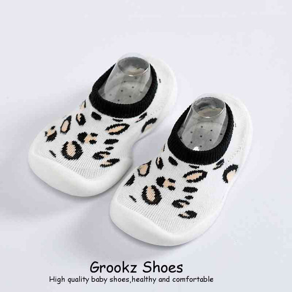 White leopard baby sock shoes at angle 2, perfect for stylish and comfortable little feet.