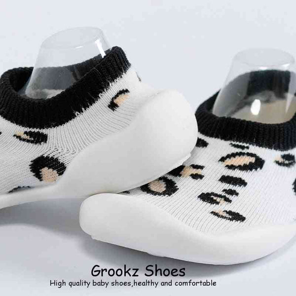 White leopard baby sock shoes from angle 3, perfect for stylish and comfortable little feet.