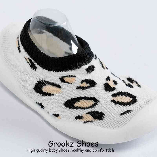 White leopard baby sock shoes at angle 5, perfect for stylish and comfortable little feet.