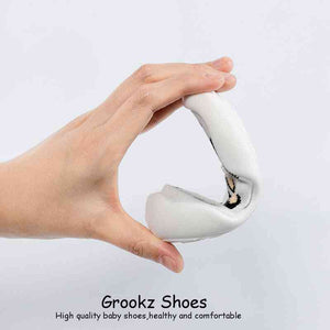 White leopard baby sock shoes, stylish and comfy, perfect for little feet. Angle 6 view.