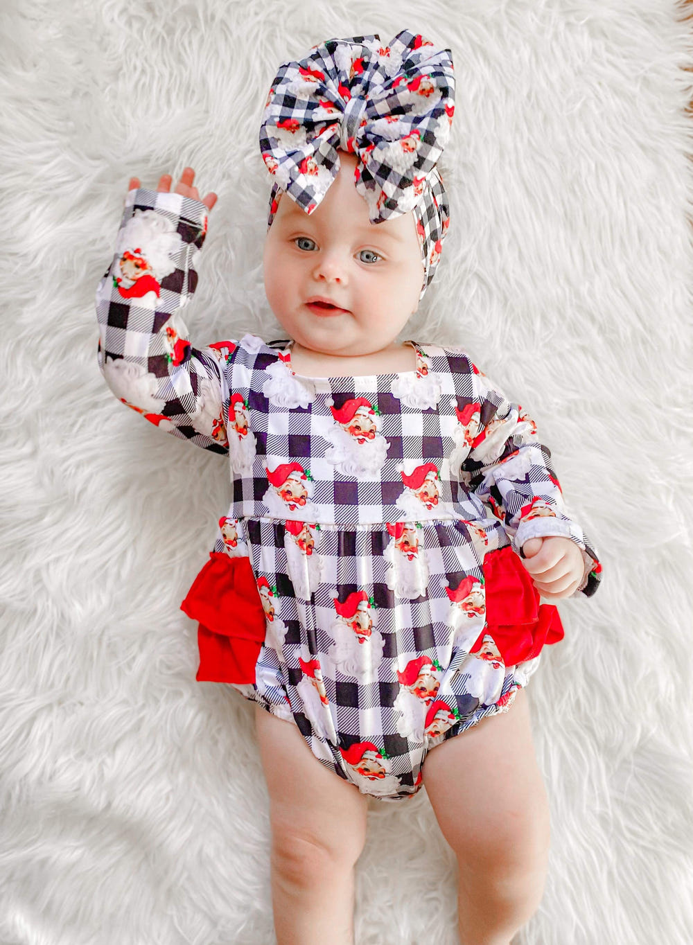 Checkered Santa ruffle romper for babies, perfect festive outfit for holiday celebrations.