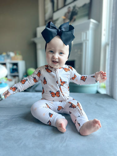Cozy Bedtime Flutter Zippy pajamas for babies, featuring a soft design and easy zip closure for comfort and convenience.