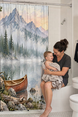 Mom holding her baby on the tub edge next to the Canoe Lake Camping shower curtain