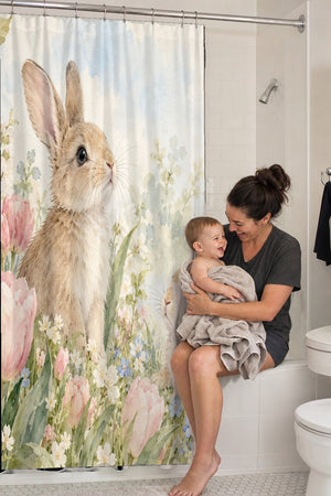 Mom holding her baby on the tub edge next to the Spring Tulips Bunny shower curtain
