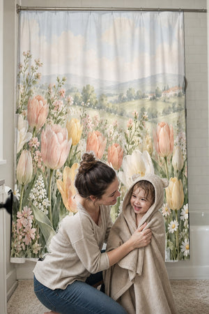 Mom drying her toddler in a hooded towel in front of the Pastel Tulip Field shower curtain