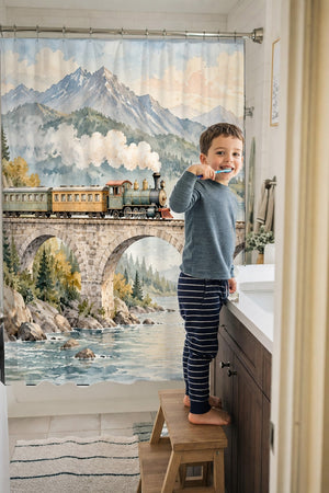 Child brushing teeth in a family bathroom with the Mountain Bridge Train shower curtain