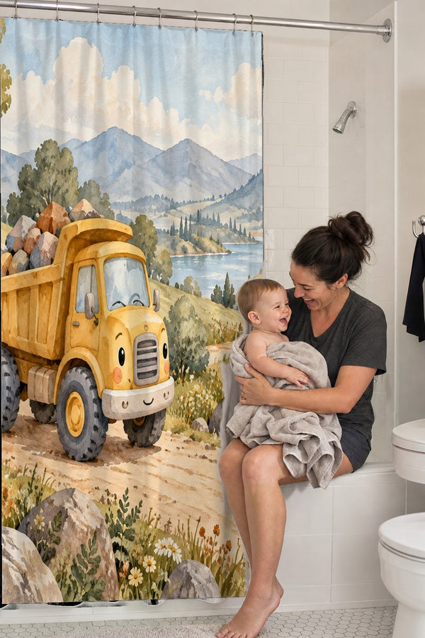 Mom holding her baby on the tub edge next to the Dump Truck Road shower curtain