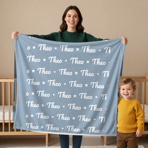 Name Pattern toddler minky blanket in dusty blue, held by a mom
