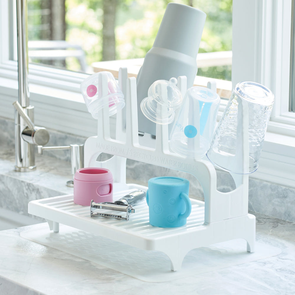PopYum Glacier White Drying Rack for baby bottles, made from recycled materials, includes silicone mat, compact countertop design.