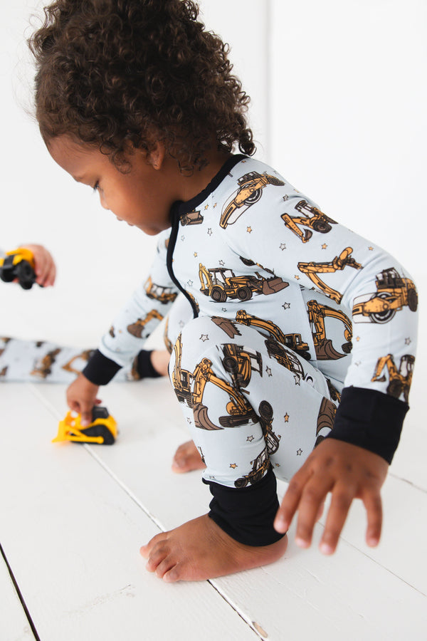 Dream Digger Zippy zip pajamas for babies, featuring a cozy design and playful patterns, shown from angle 5.