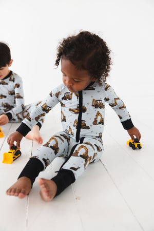 Dream Digger Zippy zip pajamas for babies, featuring a cozy design and playful patterns, shown from angle 4.