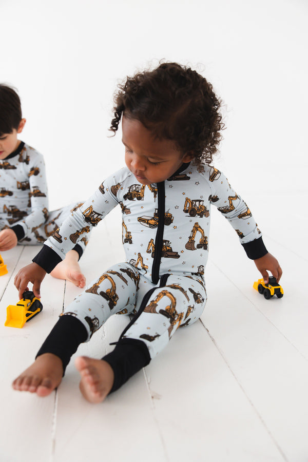 Dream Digger Zippy zip pajamas for babies, featuring a cozy design and playful patterns, shown from angle 4.