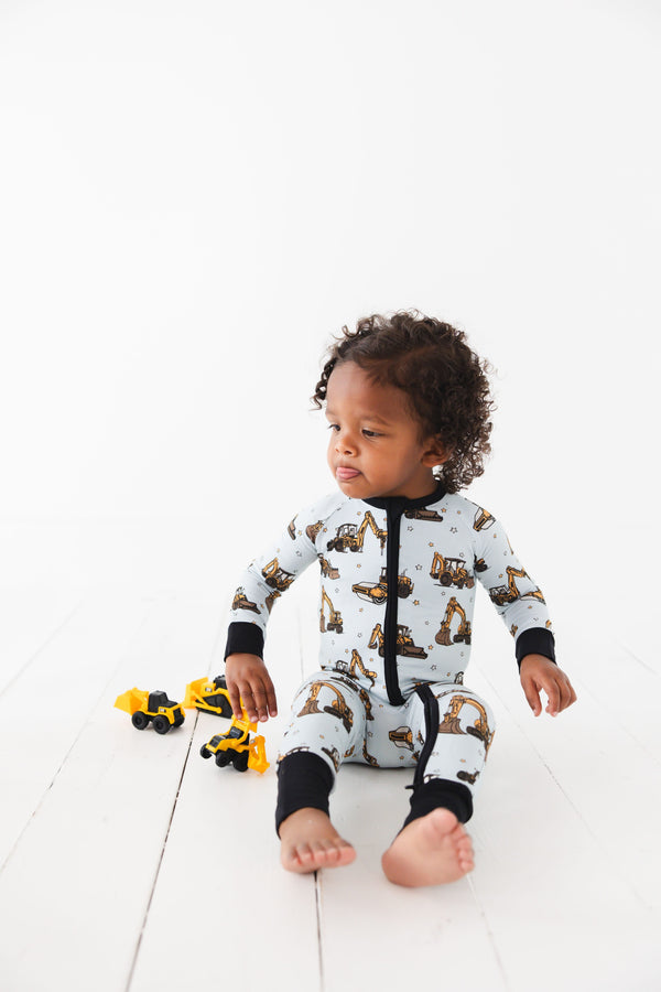 Dream Digger Zippy zip pajamas for babies, featuring a cozy design and playful patterns, shown from angle 2.