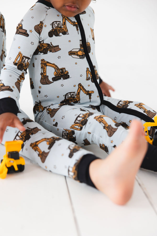 Dream Digger Zippy zip pajamas for babies, showcasing a cozy design from angle 3. Perfect for comfort and style.