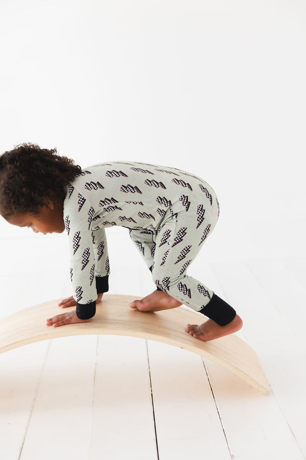 "Strike All Night Zippy baby sleep sack in cozy bedding, angle 4 view showcasing soft fabric and secure design."