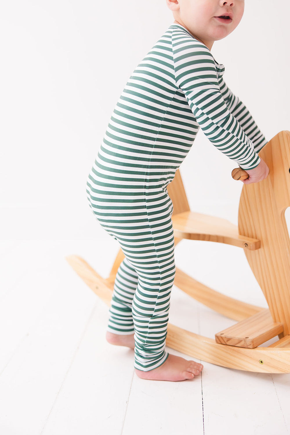 Green Stripes Zippy zip pajamas for babies, featuring a cozy design and soft fabric for comfort and style.