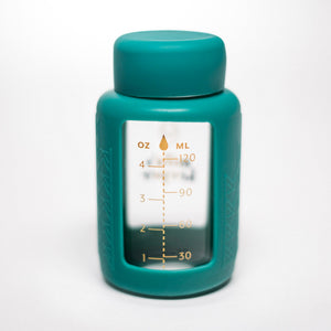 Set of 2 glass breast milk bottles at a 20-degree angle for safe and stylish milk storage.