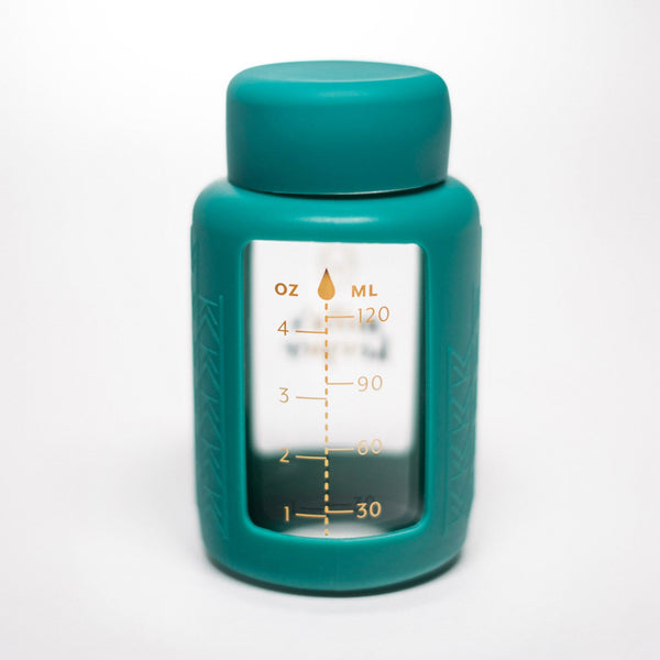 Set of 2 glass breast milk bottles at a 20-degree angle for safe and stylish milk storage.