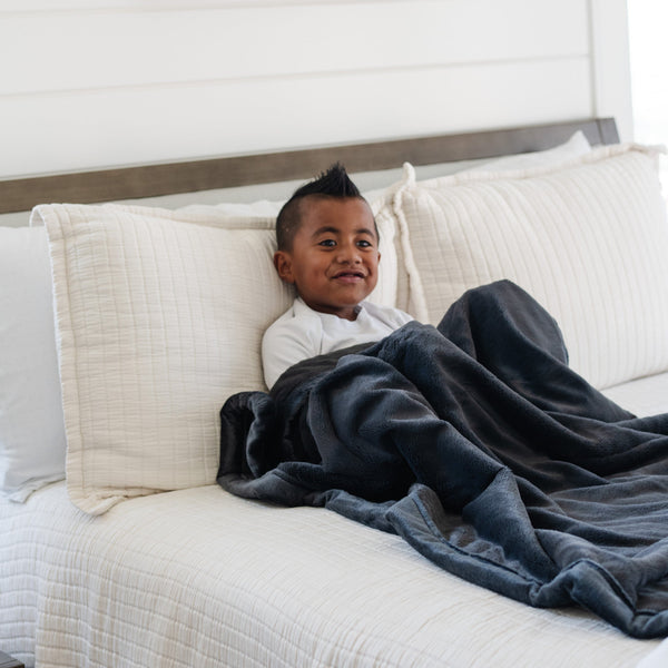 Lush toddler blankets in soft fabric, perfect for cozying up and swaddling little ones. Angle view showcasing design.