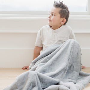 Lush toddler blankets in soft fabric, angled view showcasing cozy design for babies and toddlers.