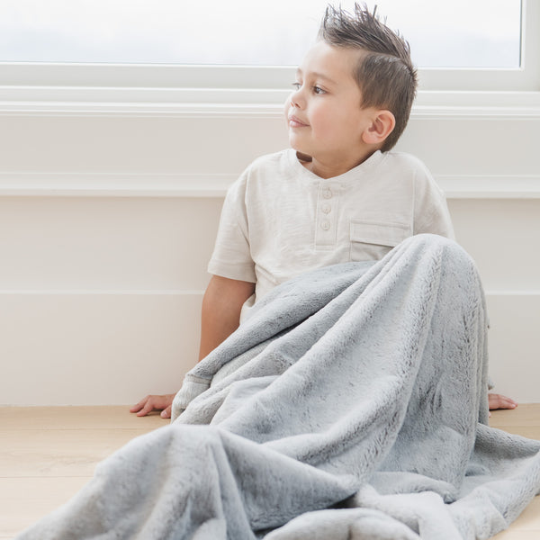 Lush toddler blankets in soft fabric, angled view showcasing cozy design for babies and toddlers.