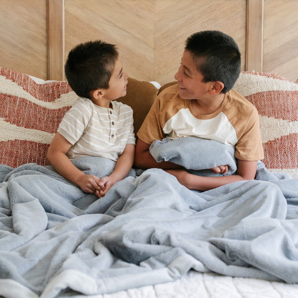Lush toddler blankets in soft fabric, perfect for cozying up and swaddling little ones. Angle view showcasing design.
