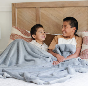 Lush toddler blankets in soft fabric, perfect for cozying up and swaddling little ones. Angle view showcasing design.