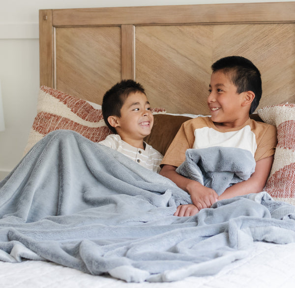 Lush toddler blankets in soft fabric, perfect for cozying up and swaddling little ones. Angle view showcasing design.