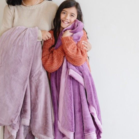 Cozy LUSH toddler blanket in soft fabric, perfect for snuggling and warmth. Ideal for blankets and swaddles.