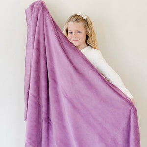 Lush toddler blankets in soft colors, perfect for cozying up and keeping little ones warm and comfortable.