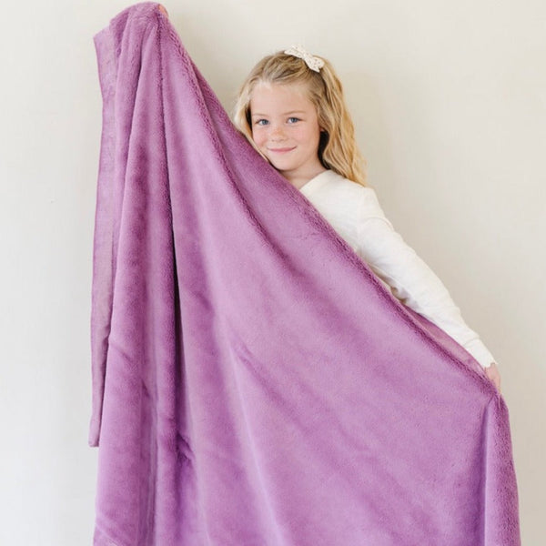 Lush toddler blankets in soft colors, perfect for cozying up and keeping little ones warm and comfortable.