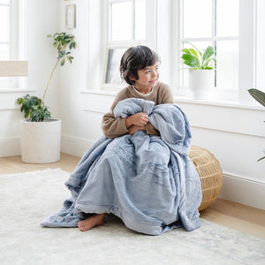 Lush toddler blankets in soft colors, perfect for cozying up or swaddling your little one.