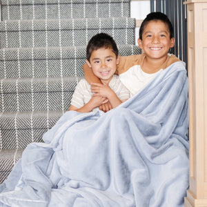 LUSH TODDLER BLANKETS in soft fabric, perfect for cozying up your little one, shown at an angle.