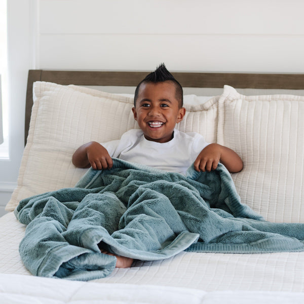 LUSH TODDLER BLANKETS in soft fabric, perfect for cozying up your little one. Angle 17 view showcasing design and texture.