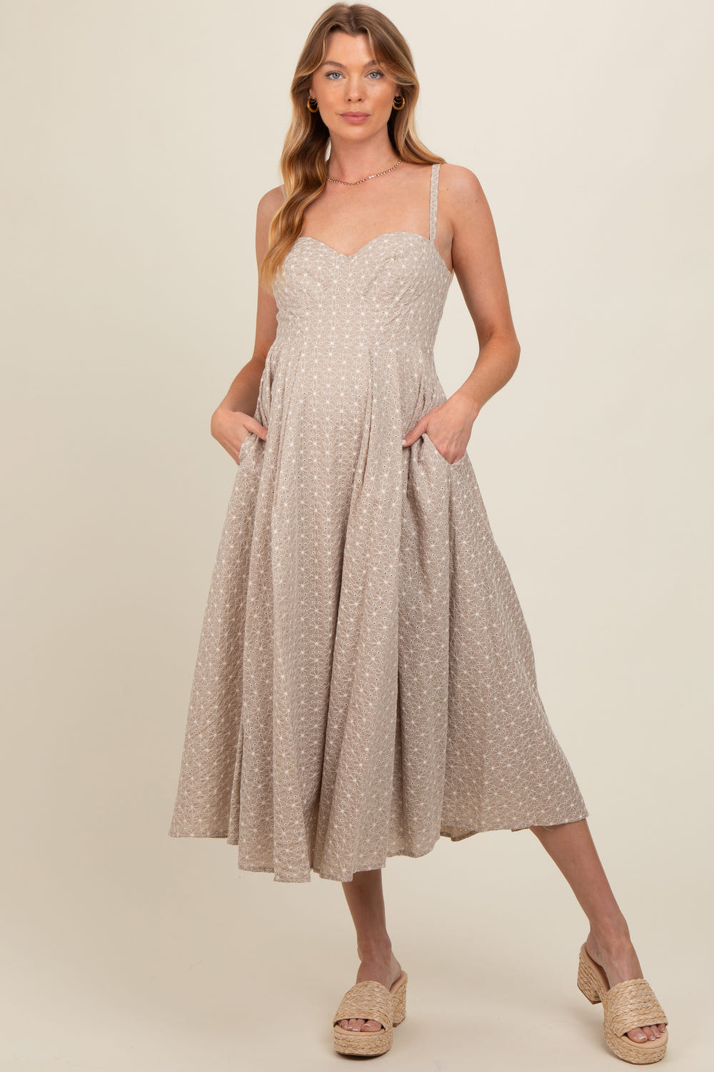 Beige floral embroidered maternity maxi dress for stylish and comfortable pregnancy wear.